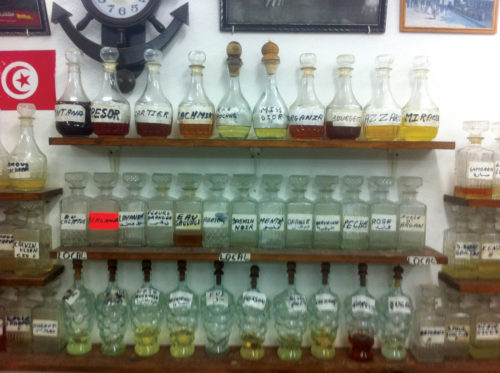 perfume-glass-flasks-on-shelves
